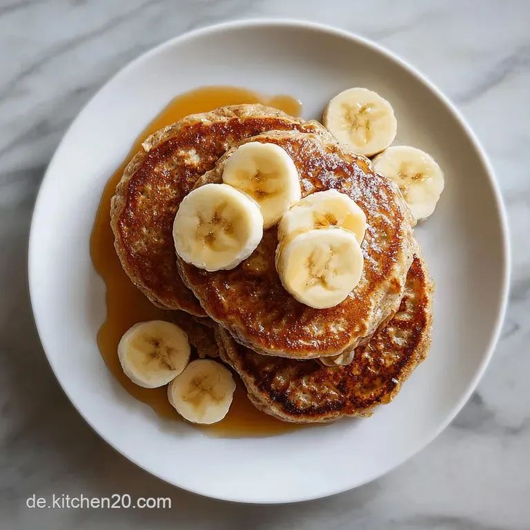 A stack of fluffy vegan pancakes plated with fresh banana slices and a drizzle of syrup. A light, healthy, and inviting br...